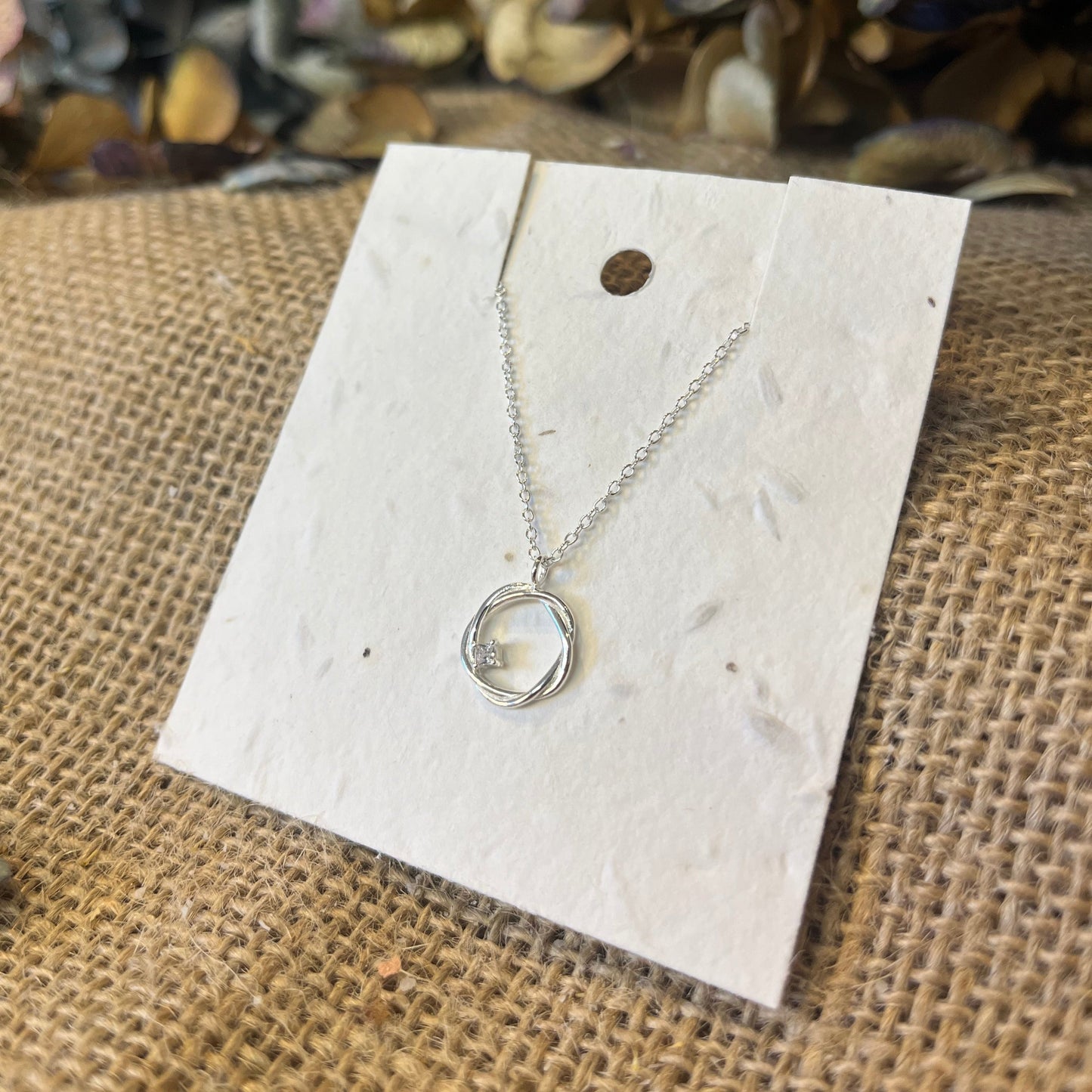 Twisted Circle - 925 Sterling Silver NecklaceTwisted Circle - 925 Sterling Silver NecklaceOur sterling silver necklaces make the ideal gift, featuring eco-friendly packaging that can be planted.
Material : 925 Sterling Silver
Silver weight : 1.4 g
ParScribe & GrowScribe & GrowTwisted Circle - 925 Sterling Silver Necklace
