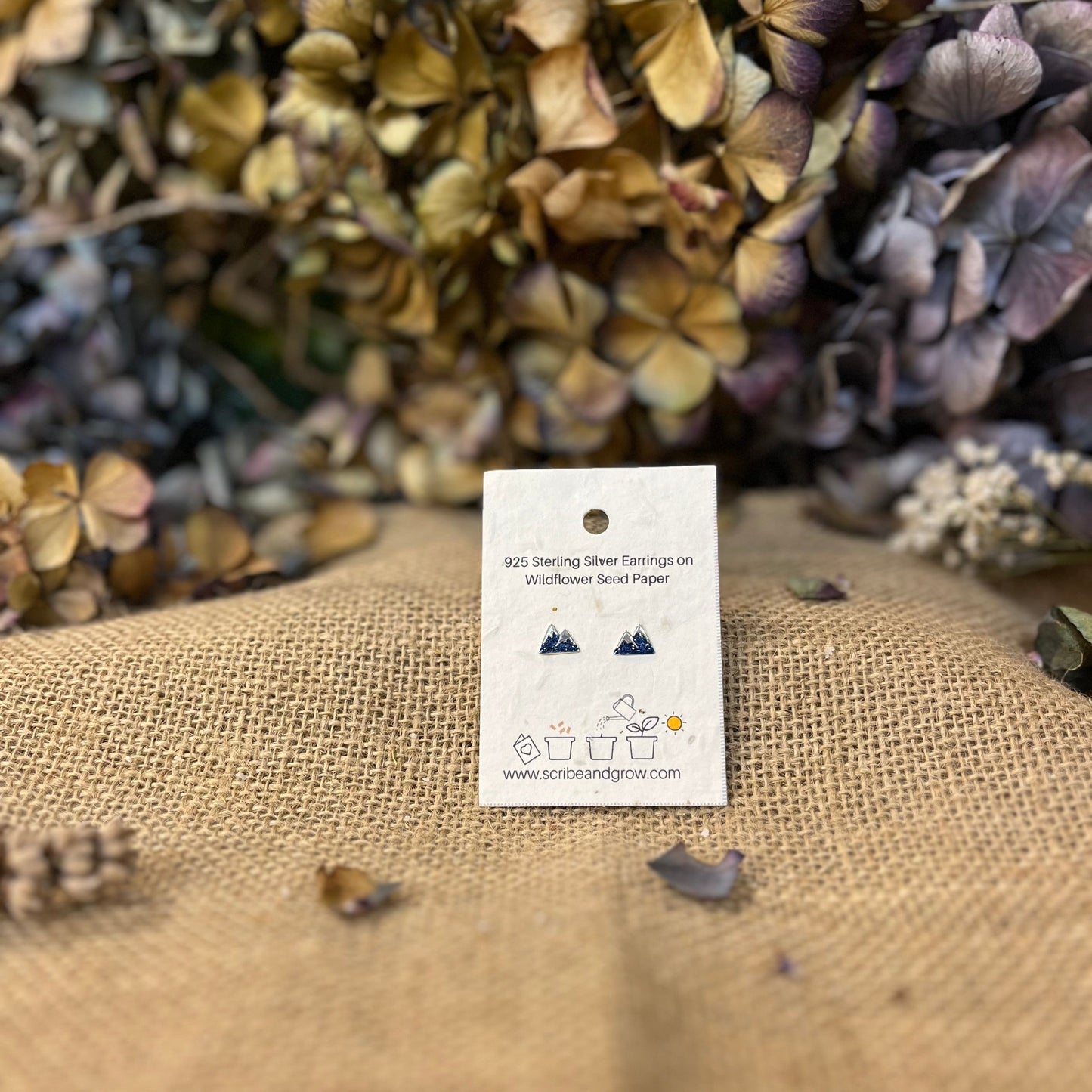 Blue Mountain - 925 Sterling Silver EarringsBlue Mountain - 925 Sterling Silver EarringsOur sterling silver earrings make the ideal gift, featuring eco-friendly packaging that can be planted.
Material : 925 Sterling Silver
Silver weight : 0.45 g
ParScribe & GrowScribe & GrowBlue Mountain - 925 Sterling Silver Earrings