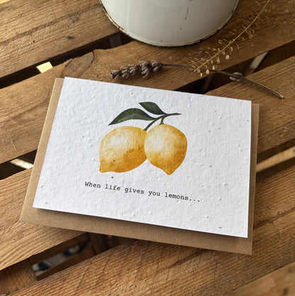 Greeting card with lemons and text on a wooden surface