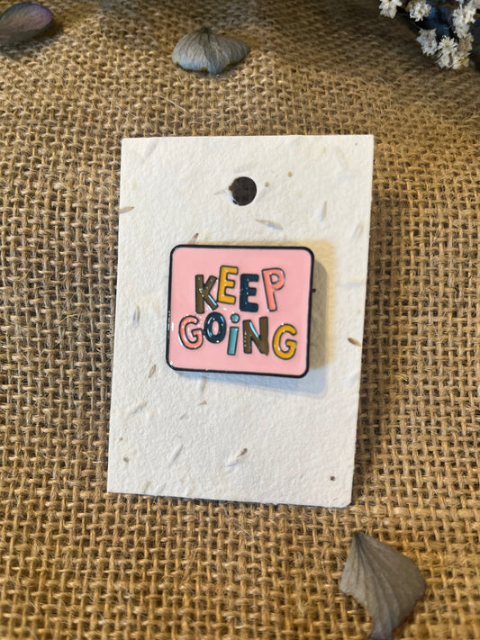 Enamel Pin - Keep GoingEnamel Pin / BadgeEnamel Pin - Keep GoingPlayful, and bold enamel pins with personality.
Enamel pins displayed on plantable wildflower seed paper – a thoughtful gift that grows!
For more details on our pinsScribe & GrowScribe & GrowEnamel Pin -