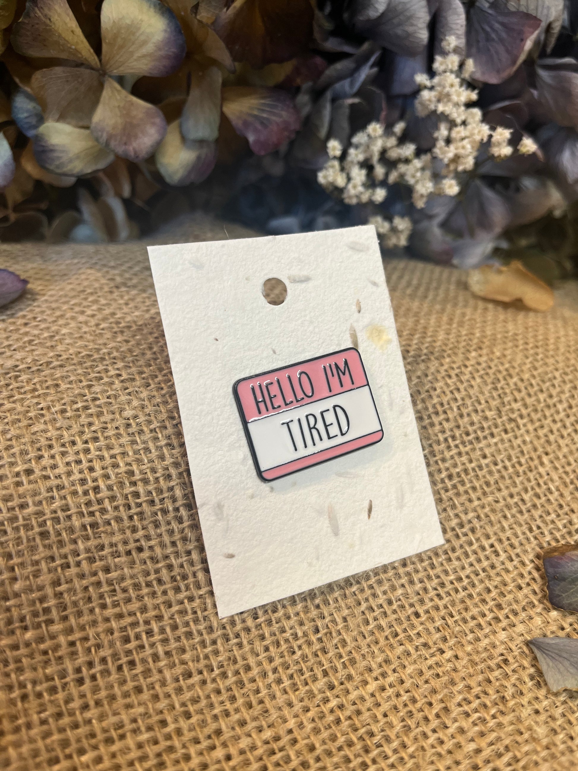 Enamel Pin - Hello I'm TiredEnamel Pin / BadgeEnamel Pin - Hello I'm TiredPlayful, and bold enamel pins with personality.
Enamel pins displayed on plantable wildflower seed paper – a thoughtful gift that grows!
For more details on our pinsScribe & GrowScribe & GrowEnamel Pin -